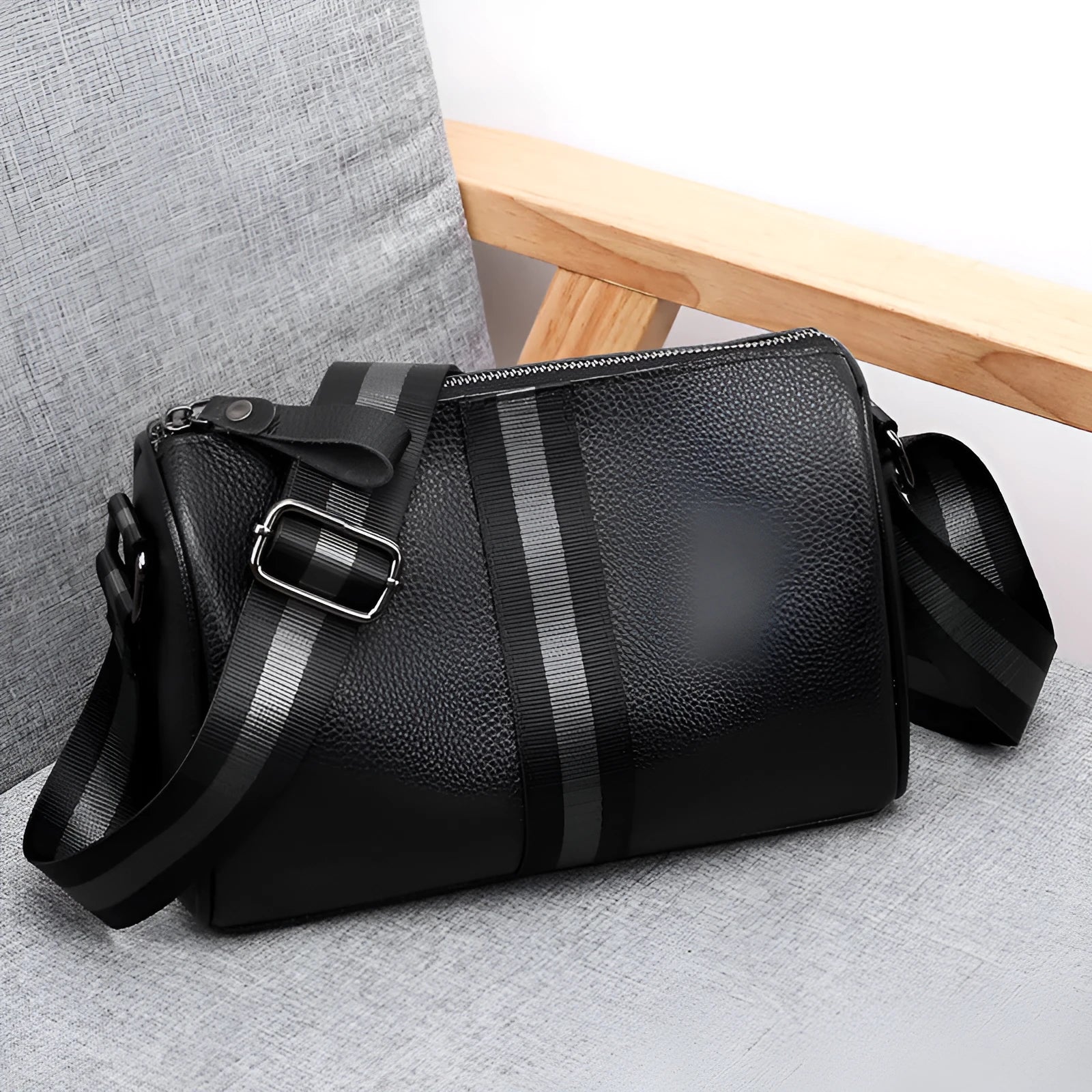 Black genuine leather one-shoulder crossbody bag with dimensions 24x16x13cm
