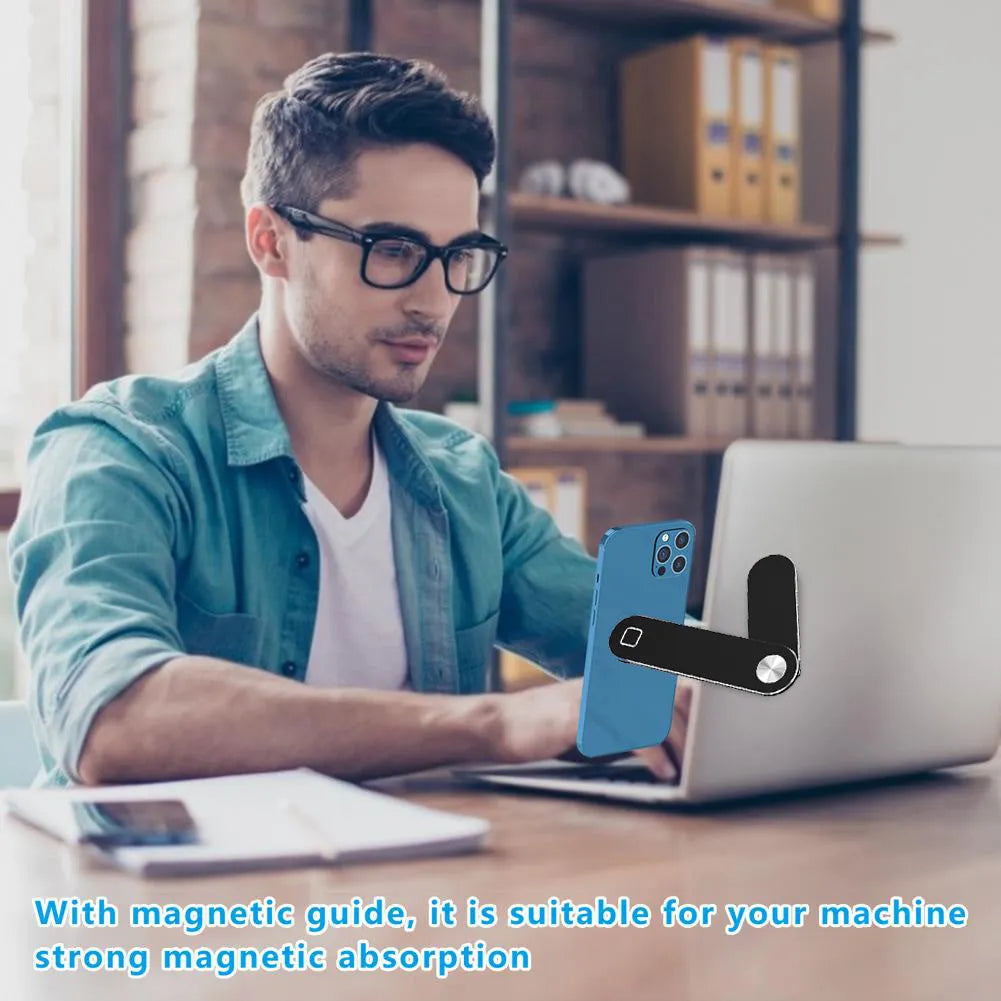 Black magnetic laptop phone holder attached to computer monitor with smartphone mounted