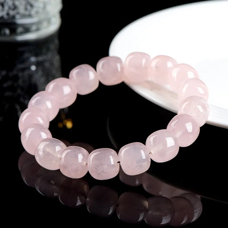 Pink bamboo and crystal barrel bead bracelet with geometric design measuring 11mm to 12mm