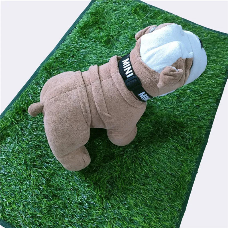 Green washable dog grass pee mat with realistic lawn texture on a patio.