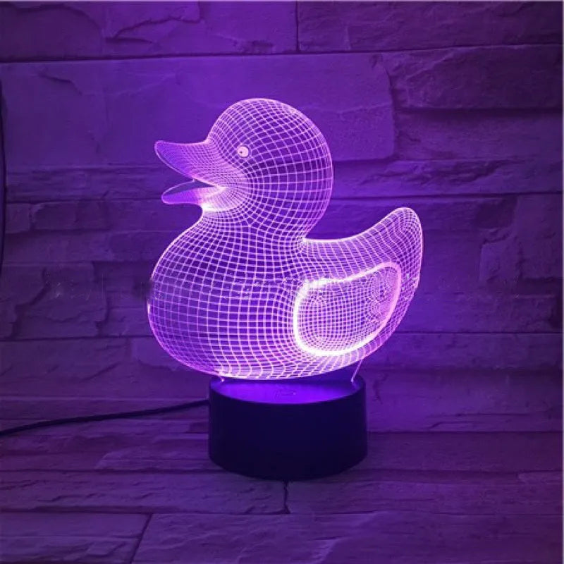 Yellow 3D duck night light with remote control on bedside table showing multiple colour options