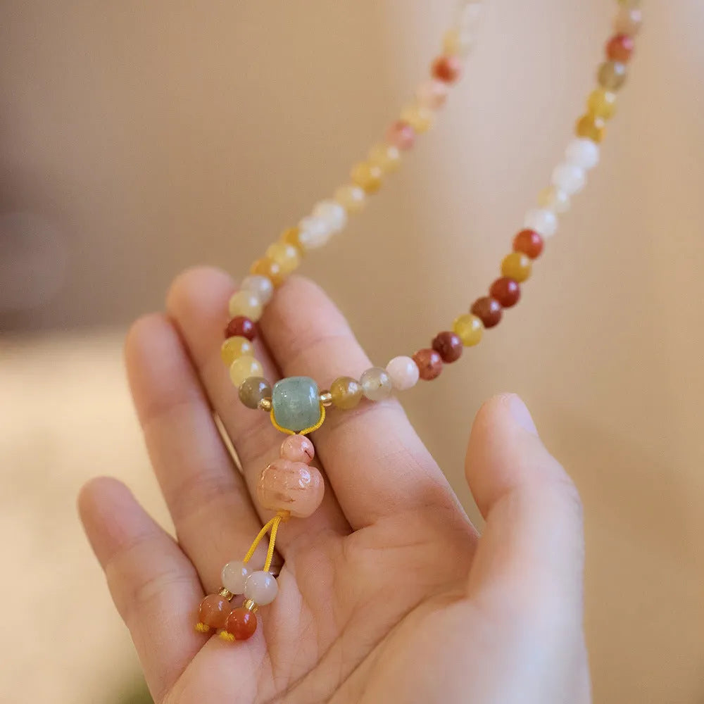 Women's handcrafted three-circle pumpkin tassel bracelet in Jinsi Jade