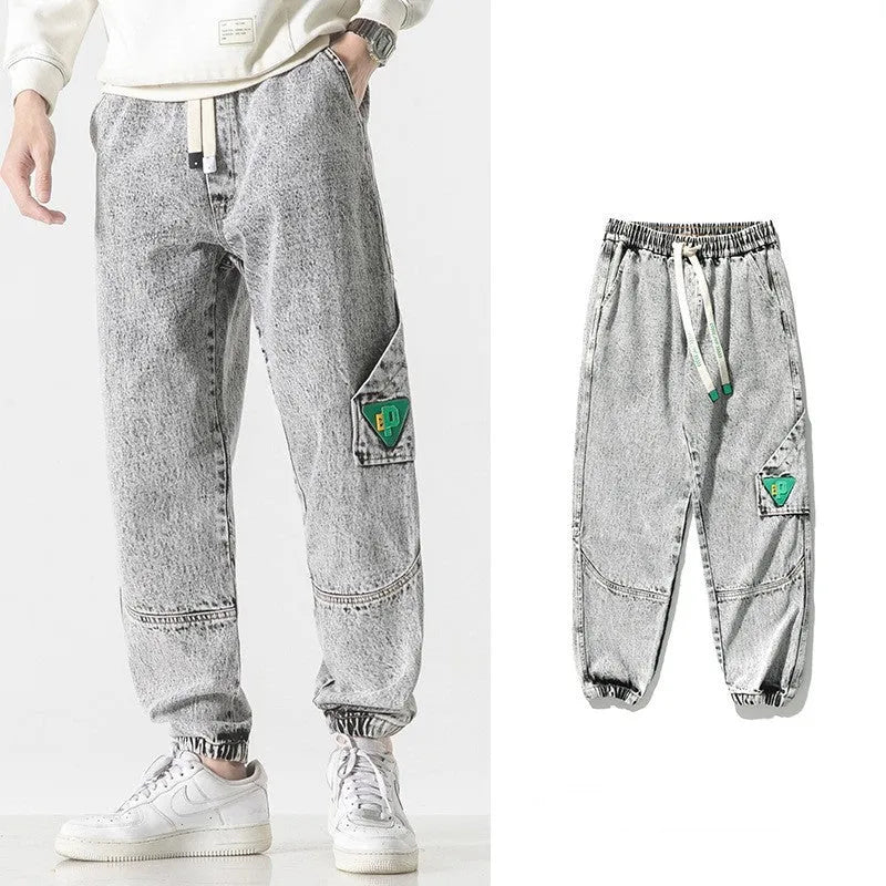 Men's loose-fit tapered cotton trousers shown in black, blue, and grey colour options.