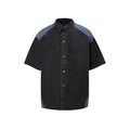 Retro washed denim suit comprising a short-sleeved jacket and trousers in blue.