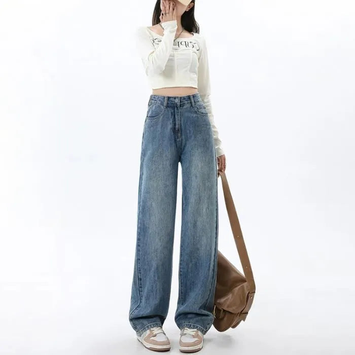 Women's retro blue high waist wide leg jeans on a hanger, showing straight cut and front button detail.