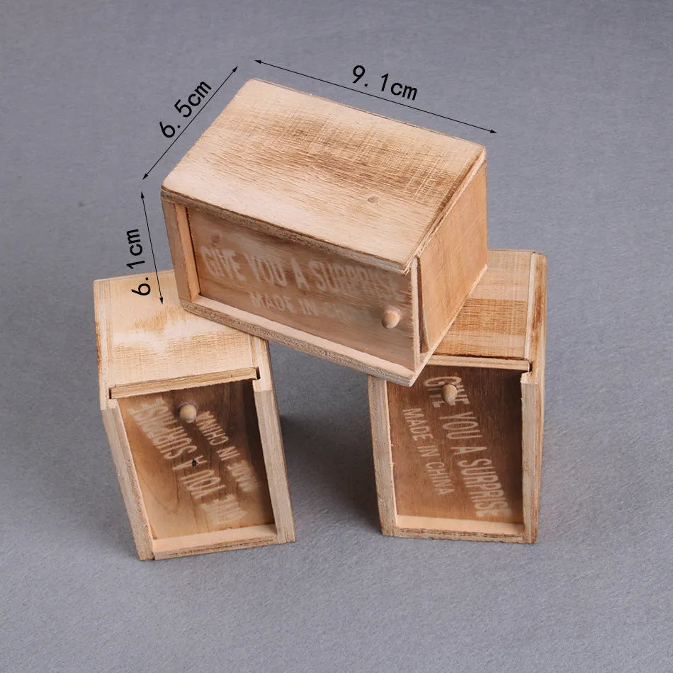 Wooden prank scare box with jumping spider surprise for April Fools jokes