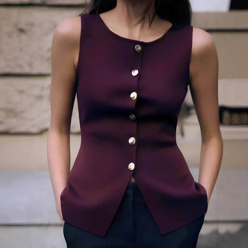Dark red slim-fit sleeveless cardigan vest with a raised 3D pattern texture on a mannequin.