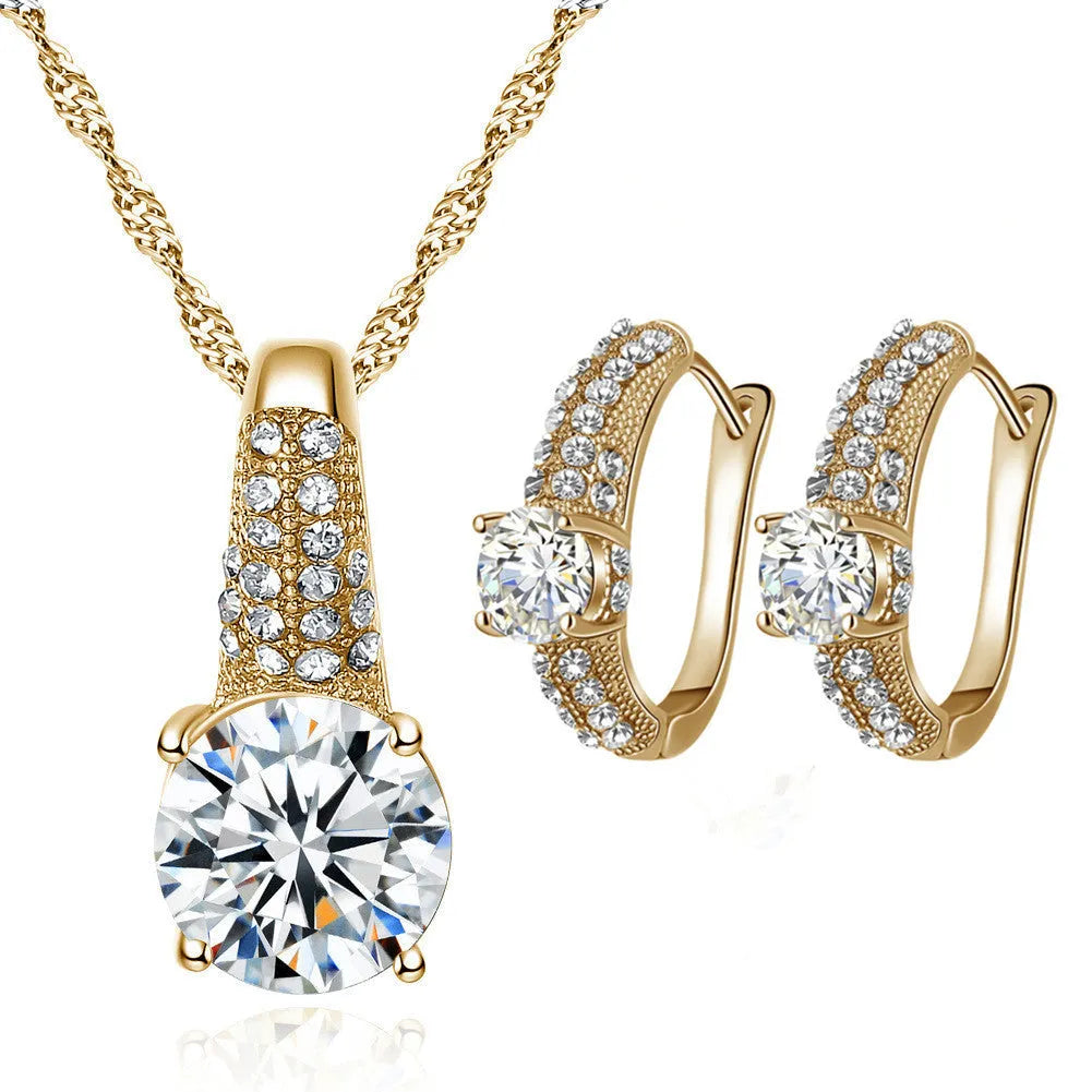 Gold and silver bridal necklace and earring set with copper base platinum finish on display