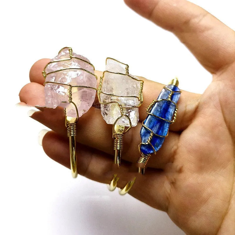 Natural crystal rough stone bracelet with gold winding geometric design showing colour mixing finish