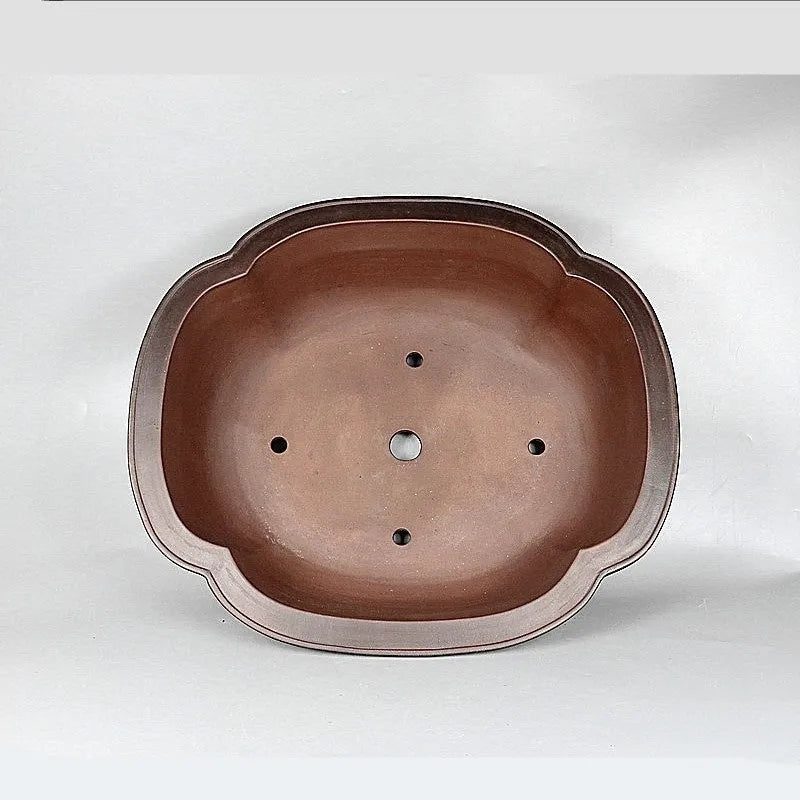 Handmade antique Chinese style purple clay flowerpot shaped like a crabapple fruit.
