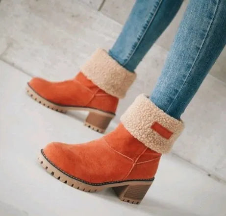 Women's suede mid-calf snow boots with thick flat sole in black, shown from the side.