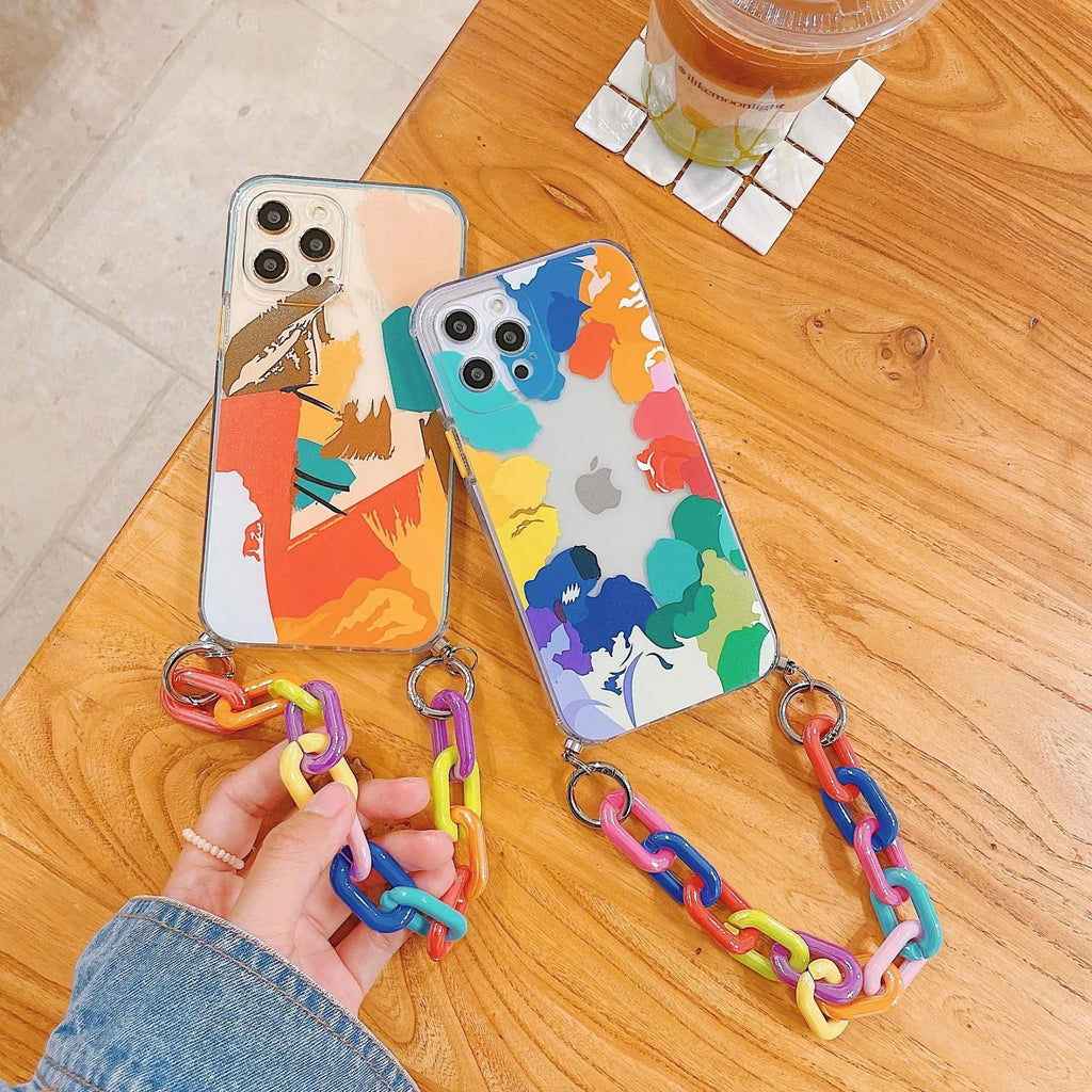 Pink graffiti design mobile phone case with an integrated wrist strap for iPhone.
