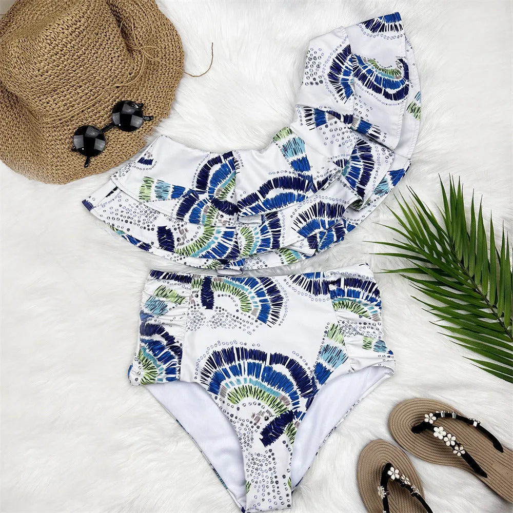 White women's one-shoulder swimsuit with lotus leaf design and side split detailing
