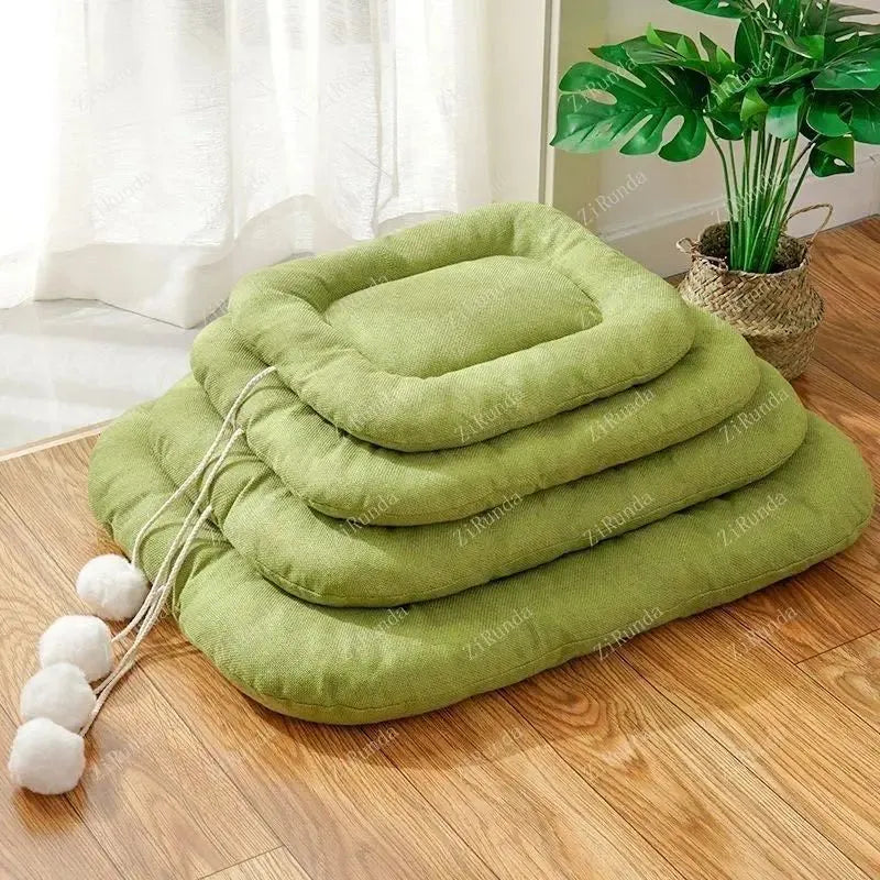 Brown and green universal dog cushion shown in four sizes for kennel sleeping and summer cooling