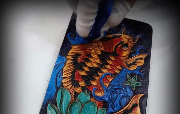 Men's carved leather short wallet in red, blue, or gold, showing open design and texture.