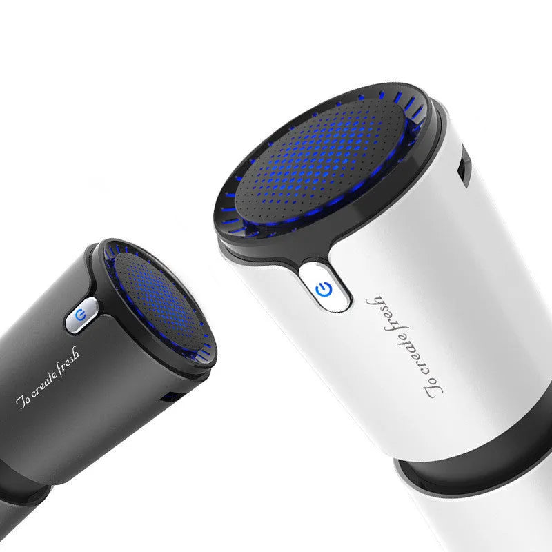 Portable mini car air purifier with True HEPA filter, USB powered, compact cup design in black