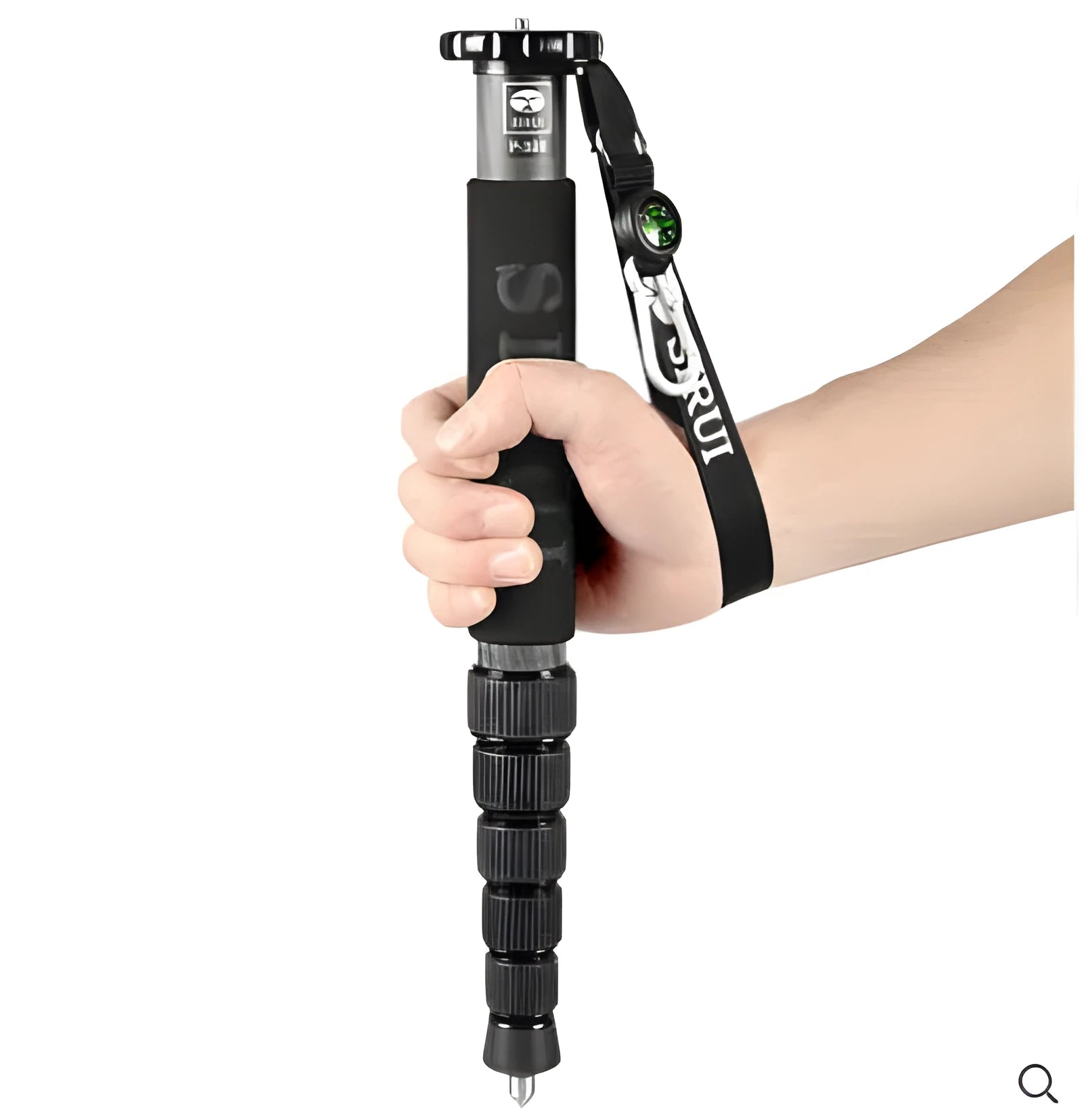 Black carbon fibre six-section SLR camera monopod extended to full height.