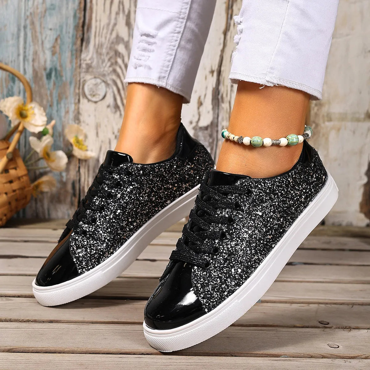 Women's plus size black lace-up board shoes with round toe and flat rubber sole.