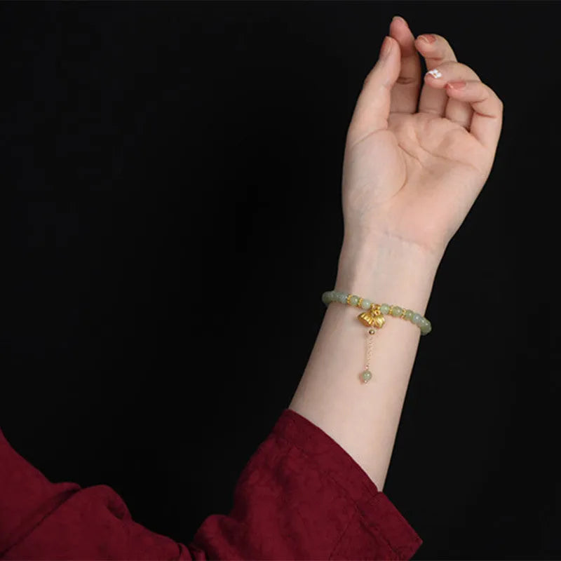 Shihuan natural Hetian jade bracelet with 6mm beads and a central fu character.