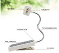 White plastic solar-powered LED garden light with a button switch, shown for outdoor use.