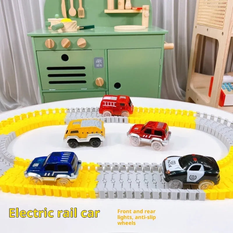 Red electric fire truck rail car with front and rear lights on toy track