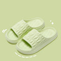 Leaf texture pattern EVA foam slippers for men and women in various colours on a white background.