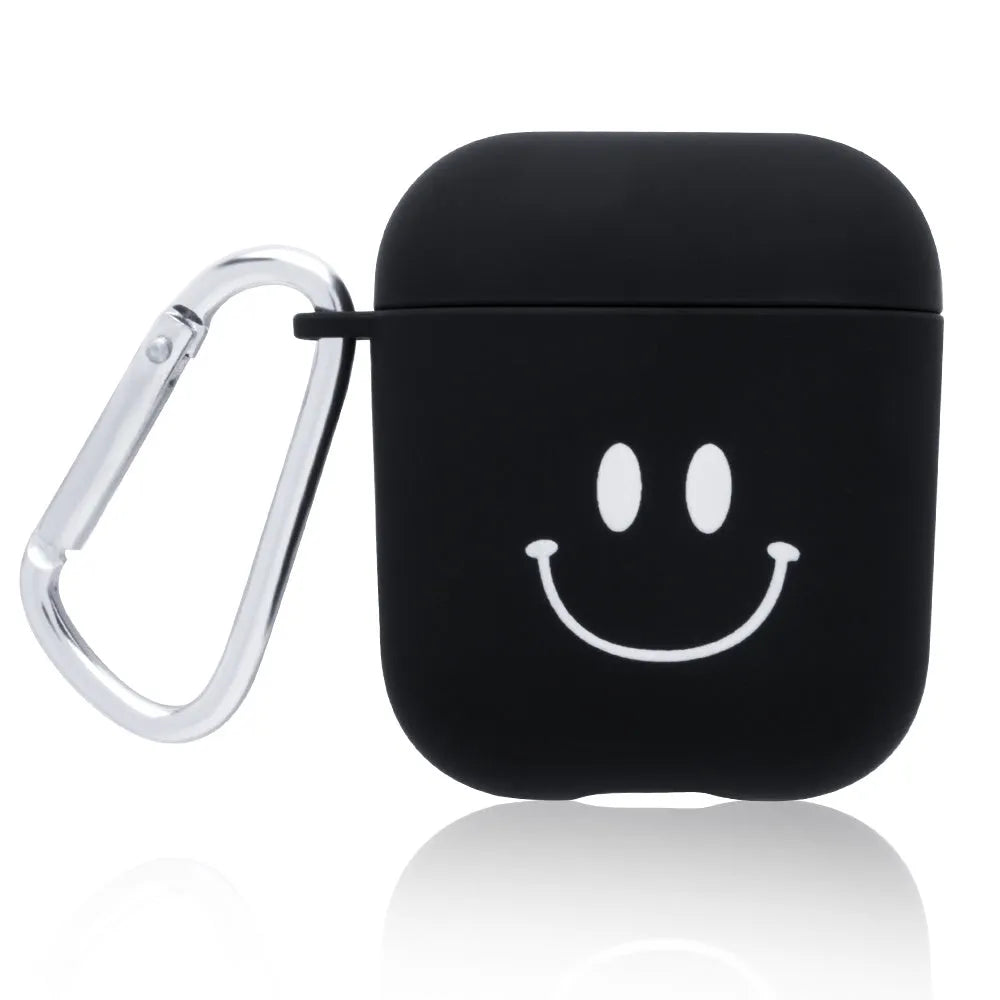 Black and pink polycarbonate AirPods case covers with decorative flower and smiley face back designs.