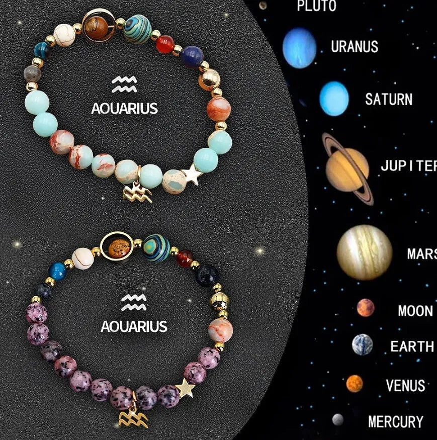 Set of two natural stone beaded bracelets for zodiac signs on a flat surface.