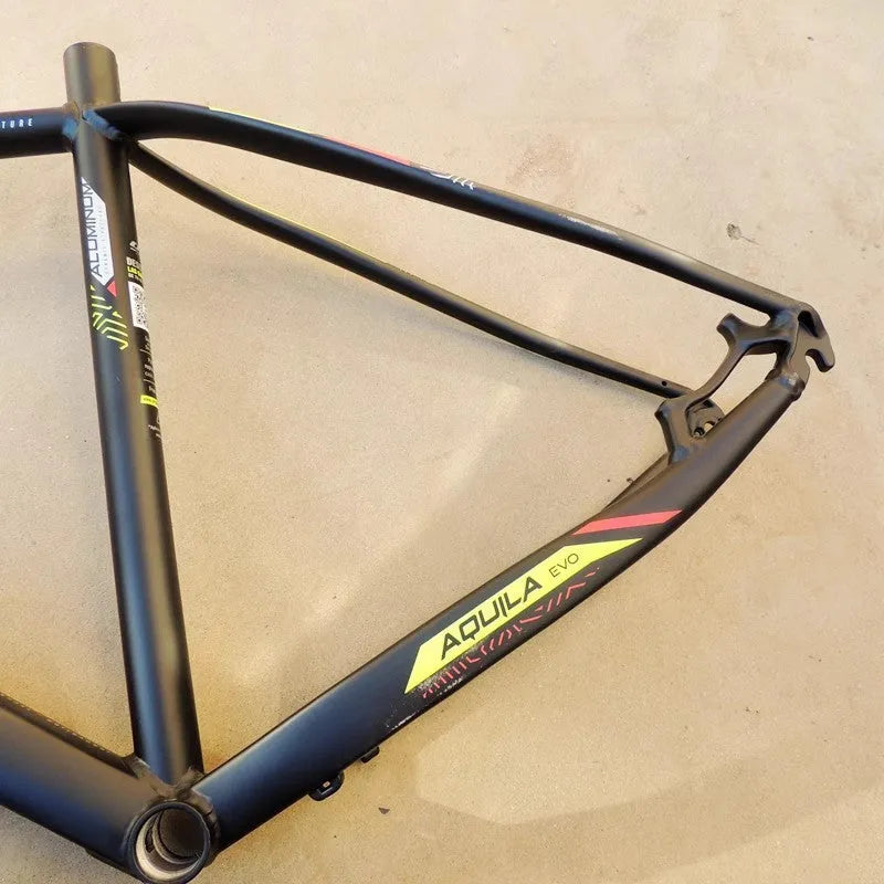 Black Green 29-inch aluminium alloy mountain bike frame showing disc brake mount and internal routing ports.