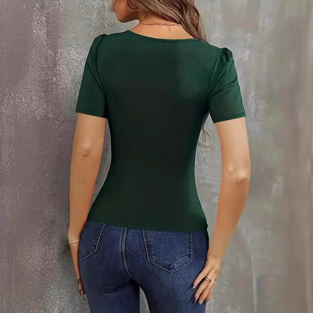 Women's wine red knitted slim fit short sleeve top with a low neckline on a hanger.