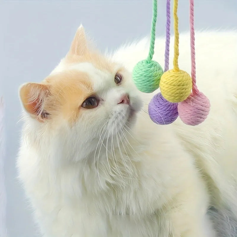 Cat toy ball with attached rope in green, pink, purple or yellow colours showing 3cm and 6cm size options