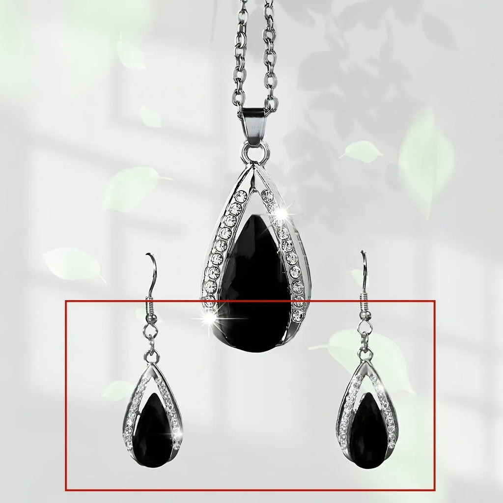 Black and red teardrop glass pendant necklace and matching earrings set on a white background.