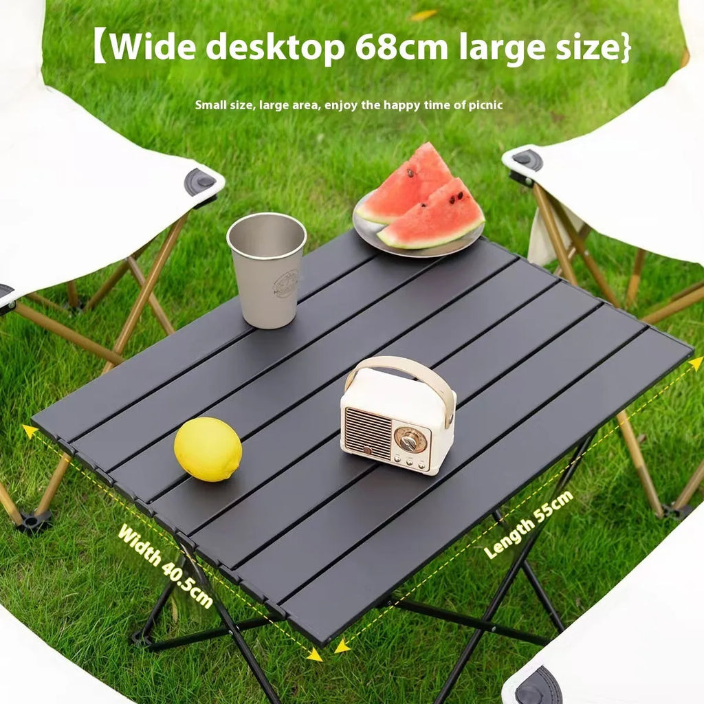 Ultralight aluminium alloy folding table in black carbon steel finish, folded flat for storage