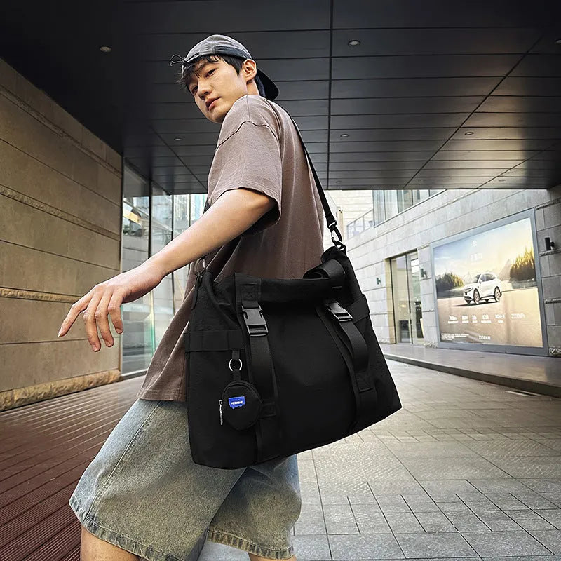 Grey Oxford cloth men's travel shoulder bag showing main compartment and detachable coin purse.
