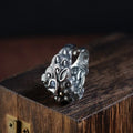 Silver open ring with jibeast pattern and diamond accents showing zodiac animal design