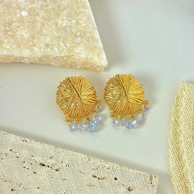 Gold geometric women's earrings with round elements in electroplated metal