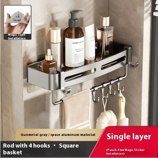 Gun grey punch-free bathroom corner storage rack with triangle basket mounted on wall.