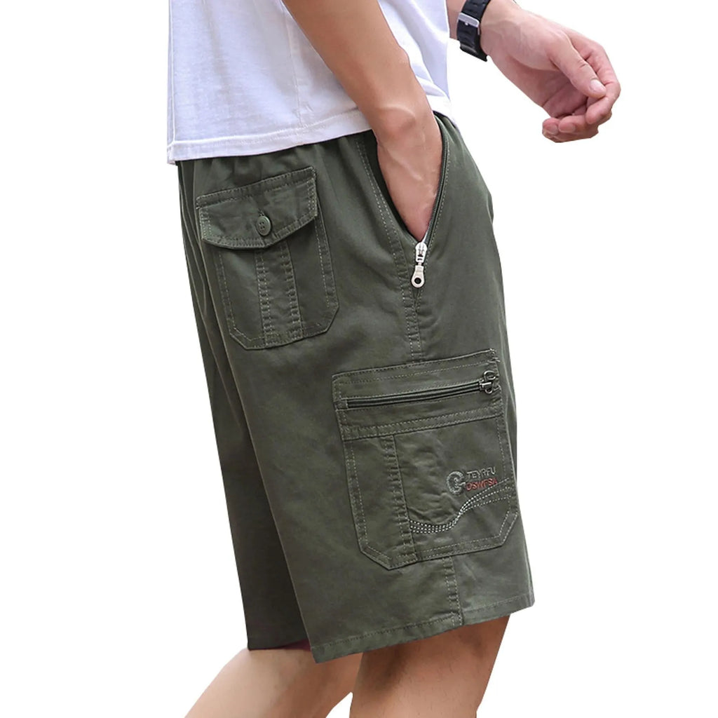 Man wearing light grey loose-fit straight-leg cotton summer trousers