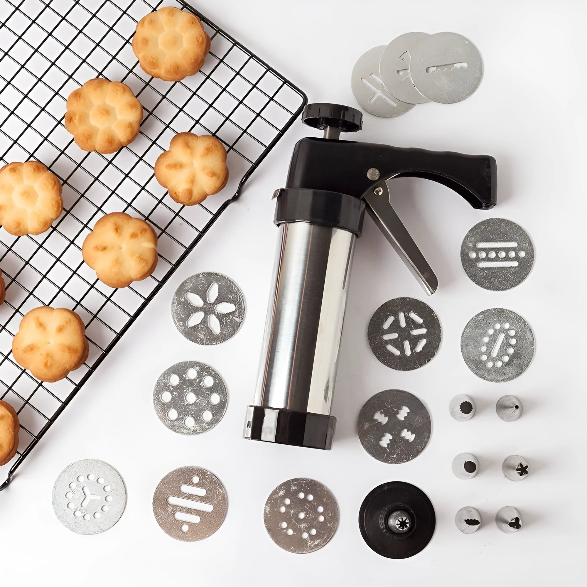 Stainless steel biscuit press machine with cookie moulds and piping nozzles in a gift box.