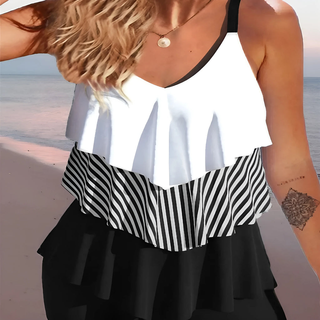 Women's backless bikini swimsuit with spaghetti straps and ruffle detailing in various colour patterns