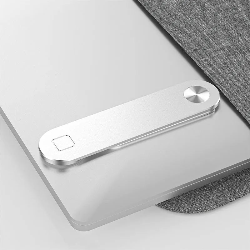 Black magnetic laptop phone holder attached to computer monitor with smartphone mounted