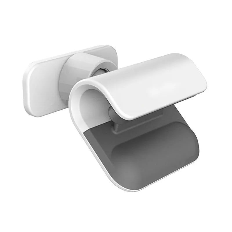 Black universal car phone holder with 360-degree rotating head on a car dashboard.