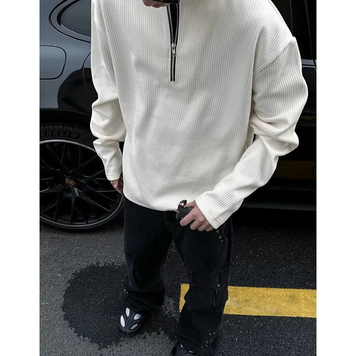 A woman's solid grey long sleeve loose fit pullover top on a hanger.