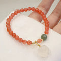 Natural red agate bracelet with 6mm beads and 8mm cat paw charm featuring gemstone inlay