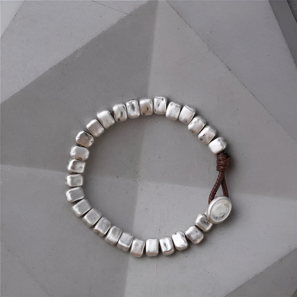 Handmade silver women's bracelet with wooden accents and irregular square design