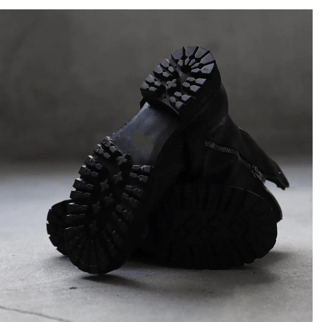 Men's dark retro ankle boots with a side zipper, shown in black.