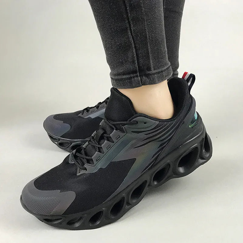 Men's breathable mesh sports shoes in black with white sole and lace-up front