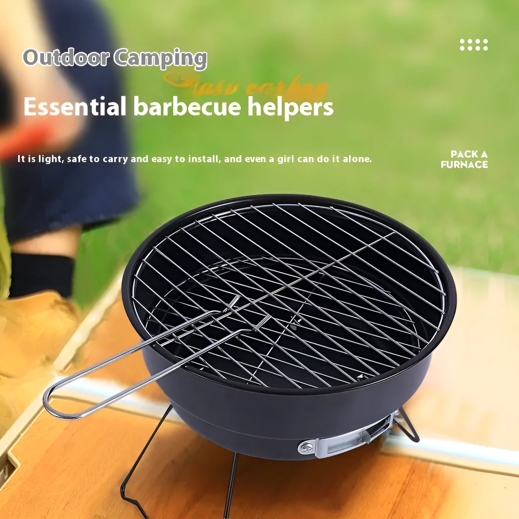 Small, round, folding metal ice stove grill with mesh top and legs, set up for outdoor use.