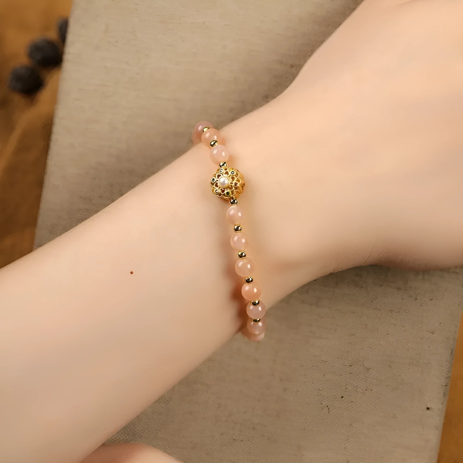 Hand-woven gray moonstone crystal bracelet with sunstone and strawberry quartz 6mm beads showing sun moon elements