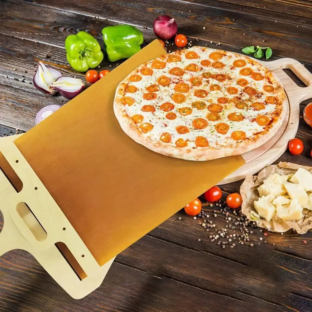 Food-grade PP plastic pizza transfer shovel on a kitchen counter, showing its size and hanging hole.